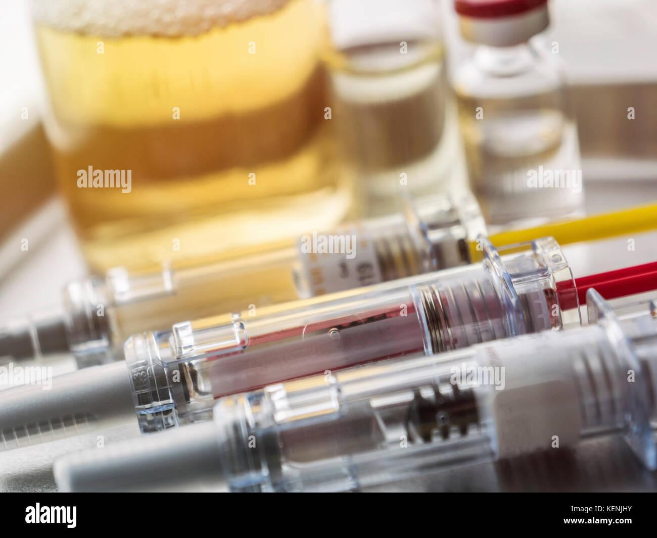 Several vials and syringe in laboratory, conceptual image Stock Photo