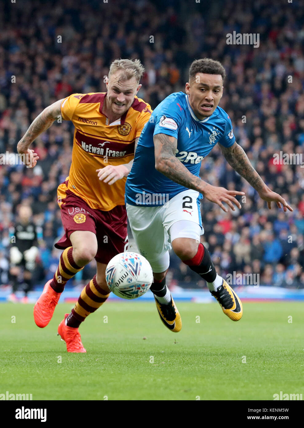 Rangers' James Tavernier and Motherwell's Richard Tait battle for the ball during the Betfred Cup, semi-final match at Hampden Park, Glasgow. Stock Photo