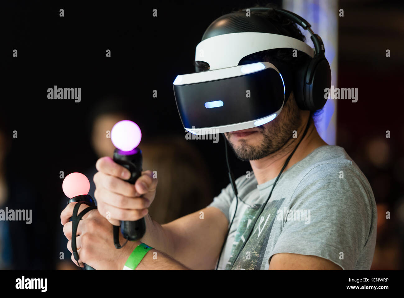 Zurich, Switzerland. 22nd Oct, 2017. A visitor of the Zurich Game Show 2017  at Zurich's exhibition centre is trying out Sony's PlayStation VR headset  and Thumbstick motion controllers. Credit: Erik Tham/Alamy Live