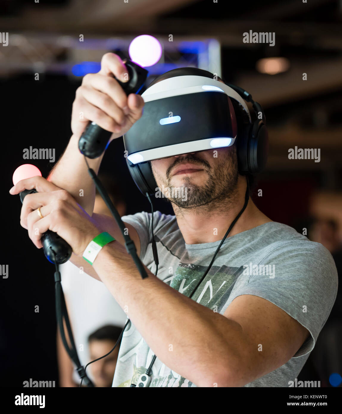 Zurich, Switzerland. 22nd Oct, 2017. A visitor of the Zurich Game Show 2017  at Zurich's exhibition centre is trying out Sony's PlayStation VR headset  and Thumbstick motion controllers. Credit: Erik Tham/Alamy Live