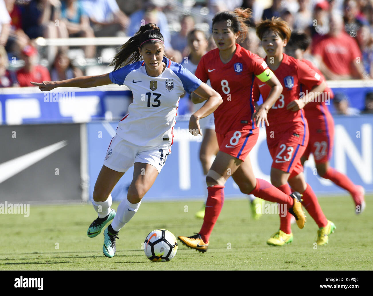 Cary, North Carolina, USA. 22nd Oct, 2017. ALEX MORGAN (13) of USA dribbles against CHO SOHYUN (8) and JANG CHANG (23) of Korea Republic. The USA played Korea Republic in a women soccer game that took place at the WakeMed Soccer Park in Cary, N.C. on Sunday, October 22, 2017. USA won 6-0. Credit: Fabian Radulescu/ZUMA Wire/Alamy Live News Stock Photo