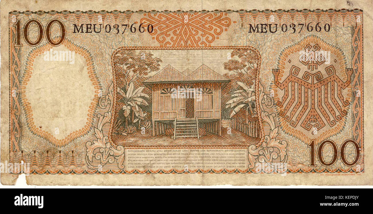 Uang Bersejarah Pecahan Rp.100 Edaran 1958 dari dua sudut pandang Stock Photo