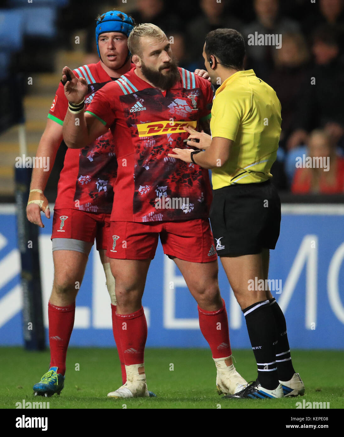 Harlequins' Joe Marler is spoken to by referee Mathieu Raynal during the Champions Cup, pool one match at the Ricoh Arena, Coventry. Stock Photo