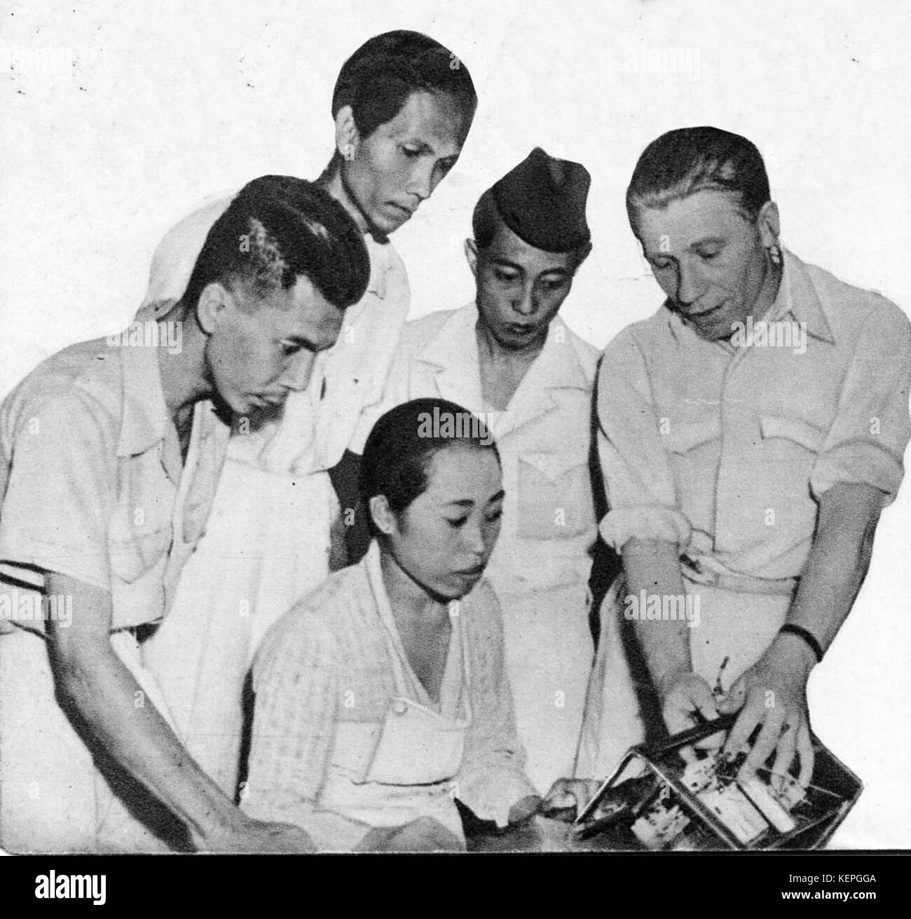 Men making a BIN 206 Philips radio, Know Indonesia... Know Your Friend, p30 Stock Photo