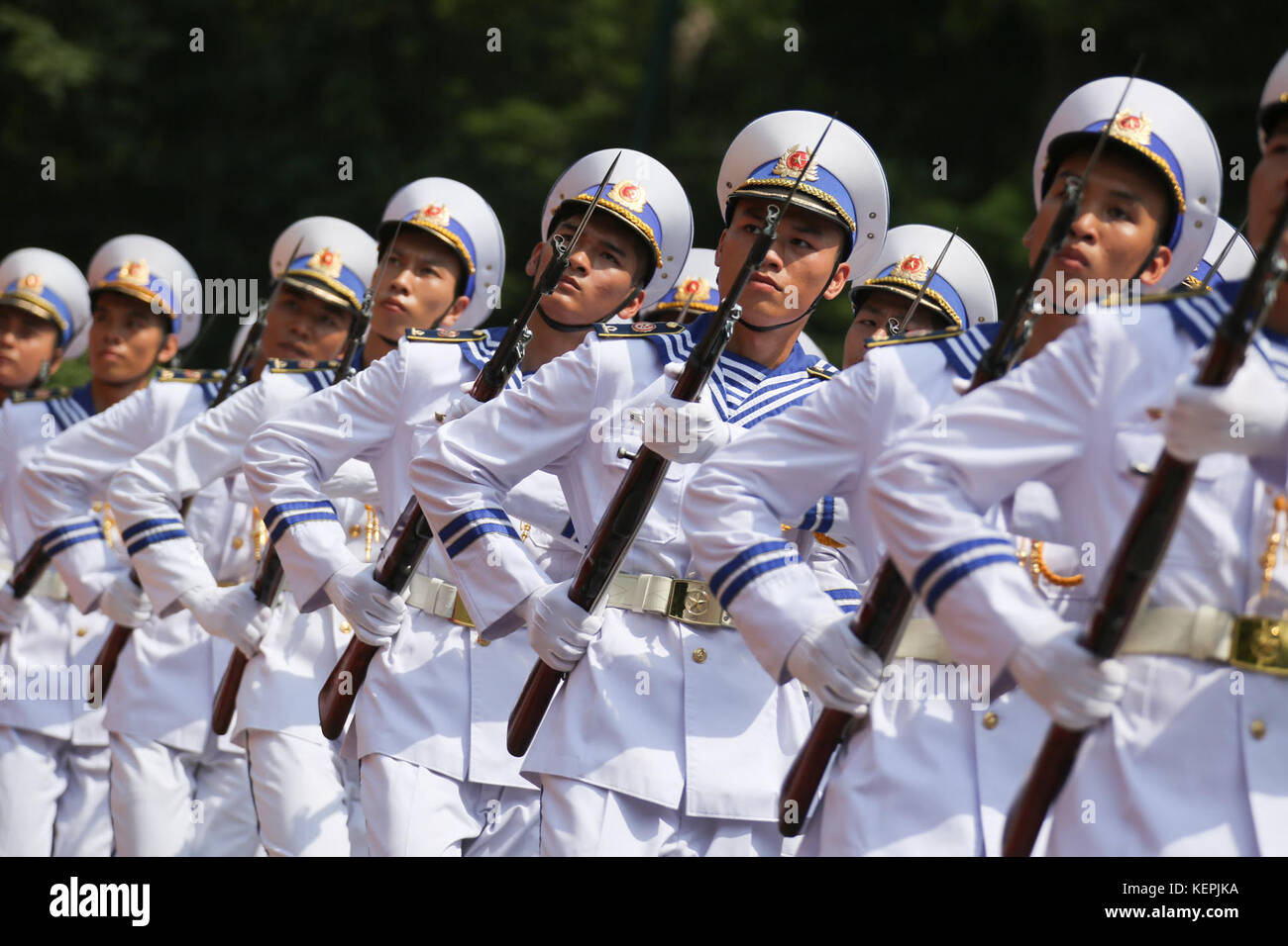 Vietnamese honor guards display marching skills in a military parade on