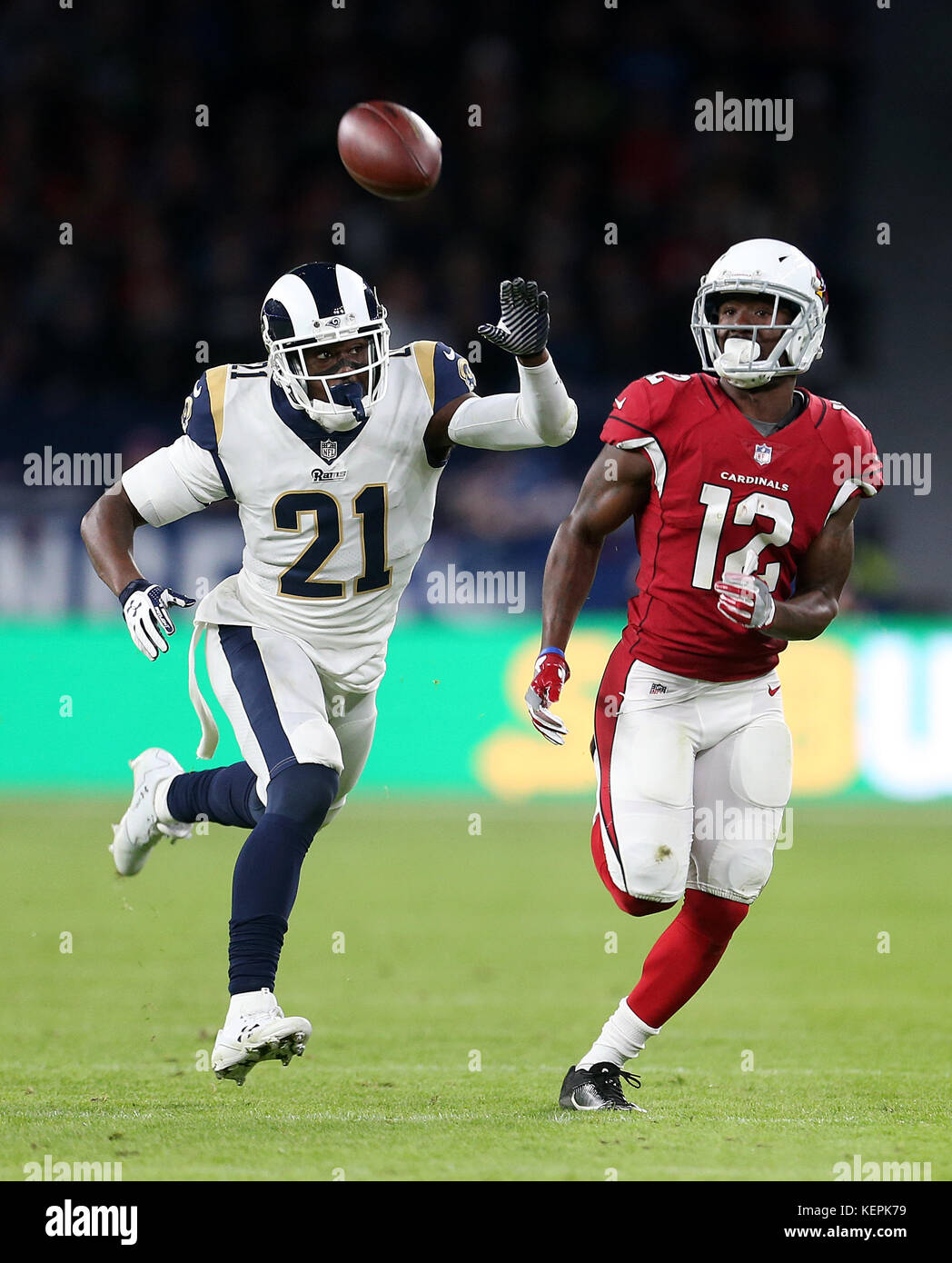 Arizona Cardinals' John Brown (right) chases down a pass under pressure from Los Angeles Rams' Kayvon Webster during the International Series NFL match at Twickenham, London. Stock Photo