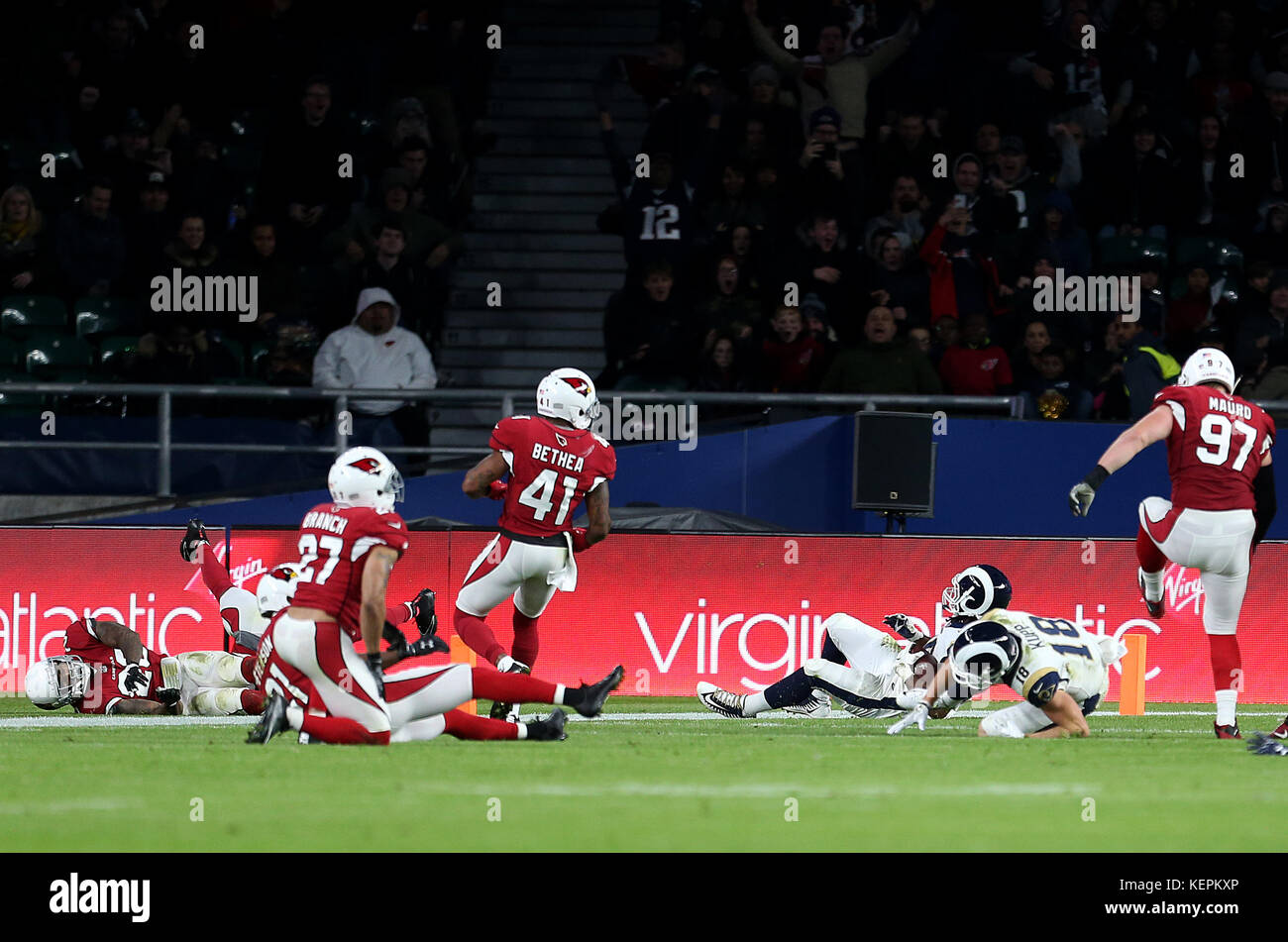 Los Angeles Rams Todd Gurley (third right) dives in to score hisisdes first touchdown during the International Series NFL match at Twickenham, London. Stock Photo