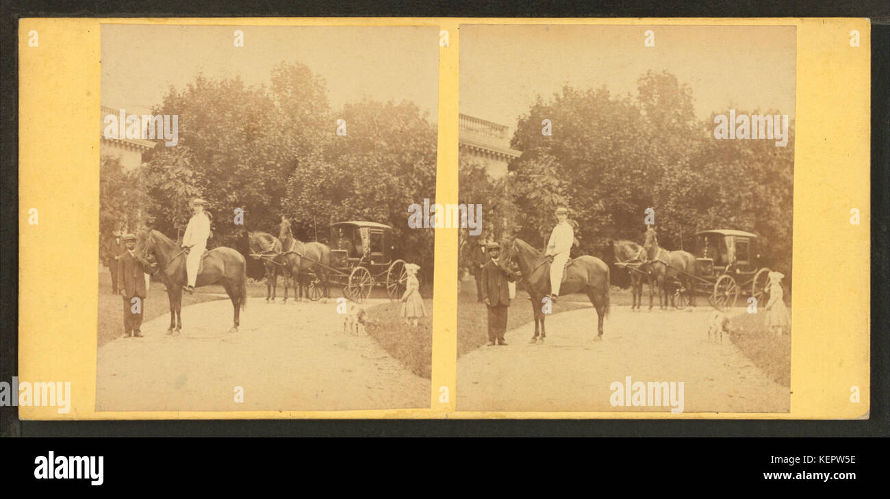 View of African American groom holding reins of horse with rider, from Robert N. Dennis collection of stereoscopic views Stock Photo