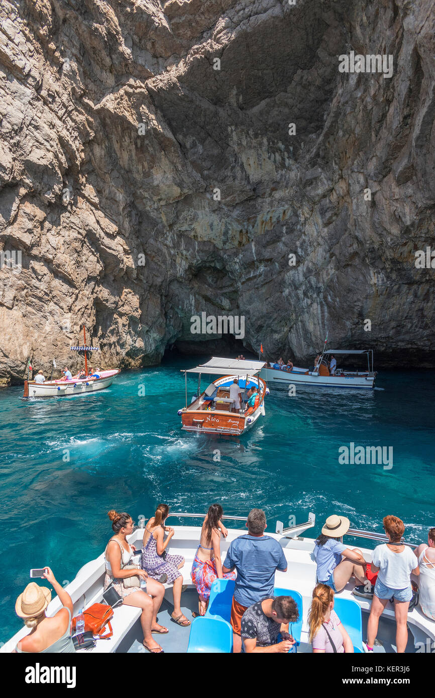 tourists on boat trips visit grotta verda on the island of capri, italy. Stock Photo