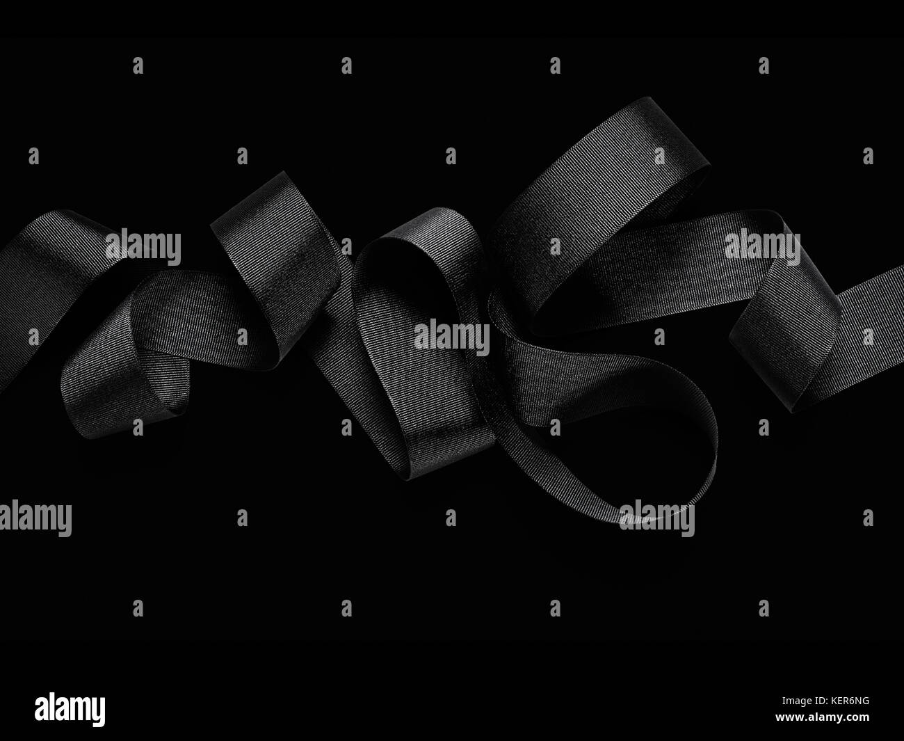Close up of black ribbon isolated on black background Stock Photo Alamy