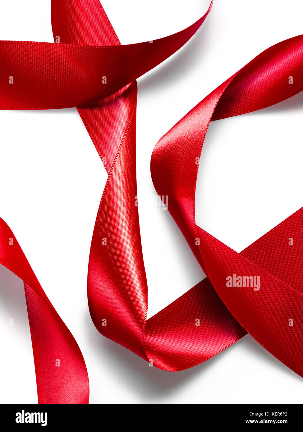 Red satin silk ribbon abstraction isolated on white background Stock