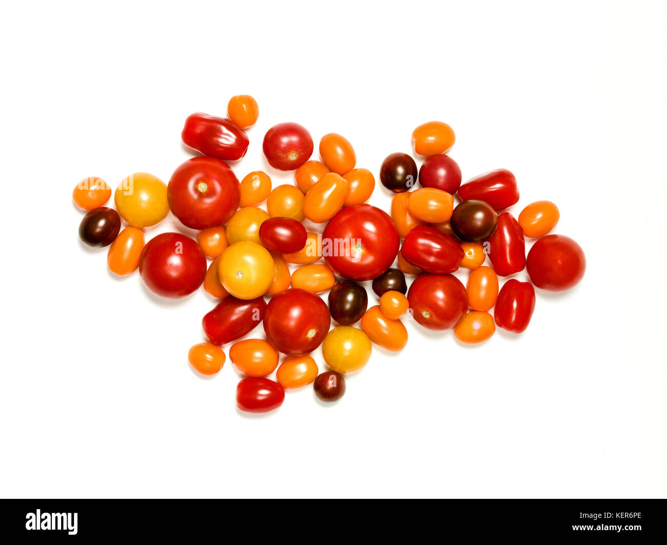 Assortment of fresh bright multicolor heirloom tomatoes isolated on white Stock Photo