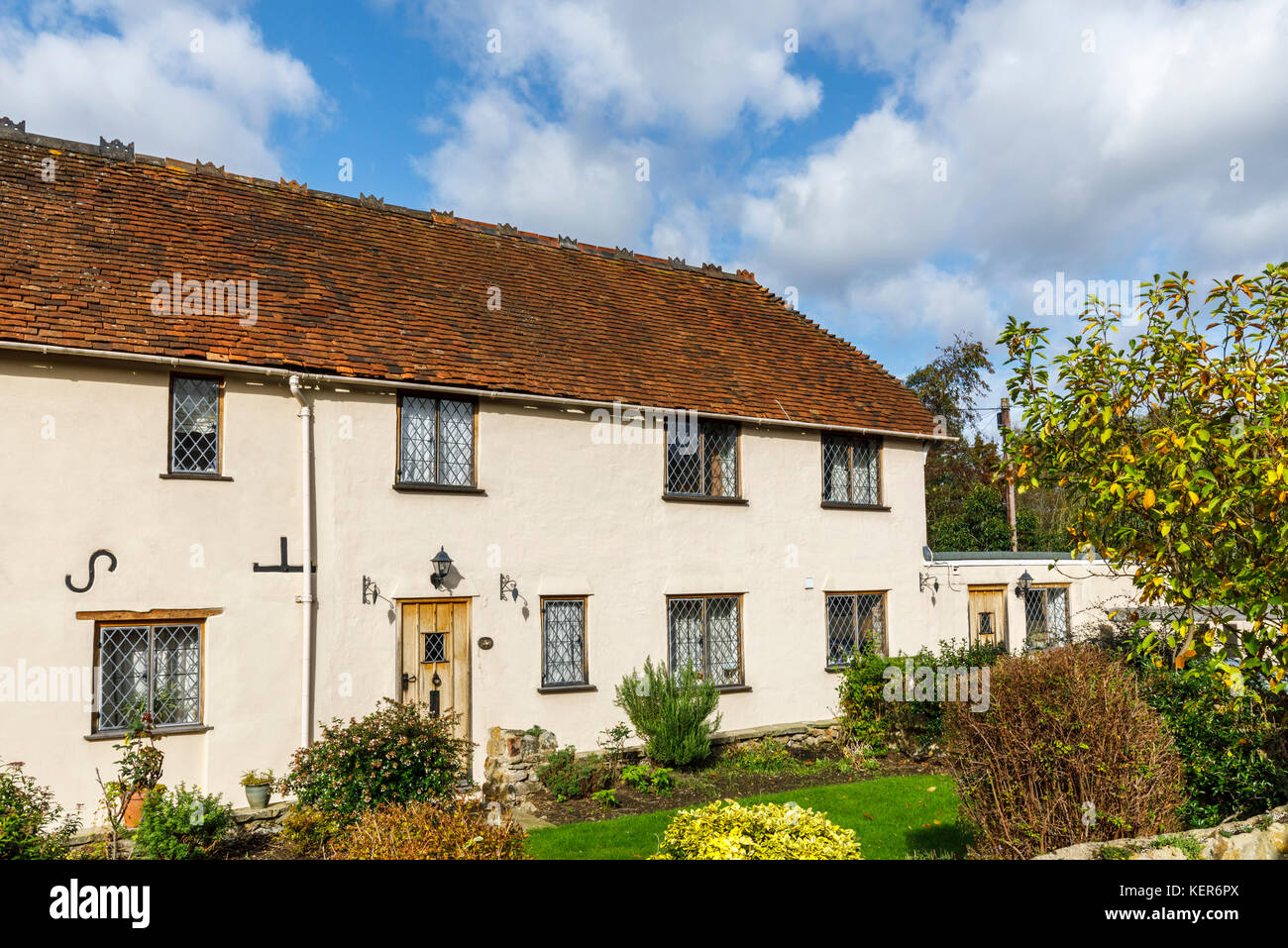 Charming country cottage with leaded light windows and wooden front