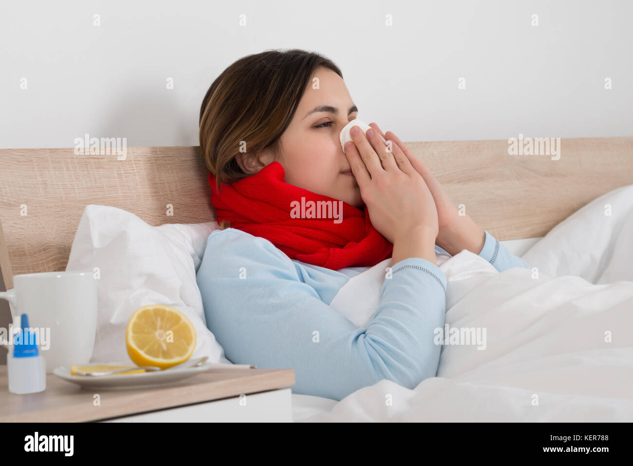 Portrait Of A Young Woman With Handkerchief Blowing Her Nose Stock