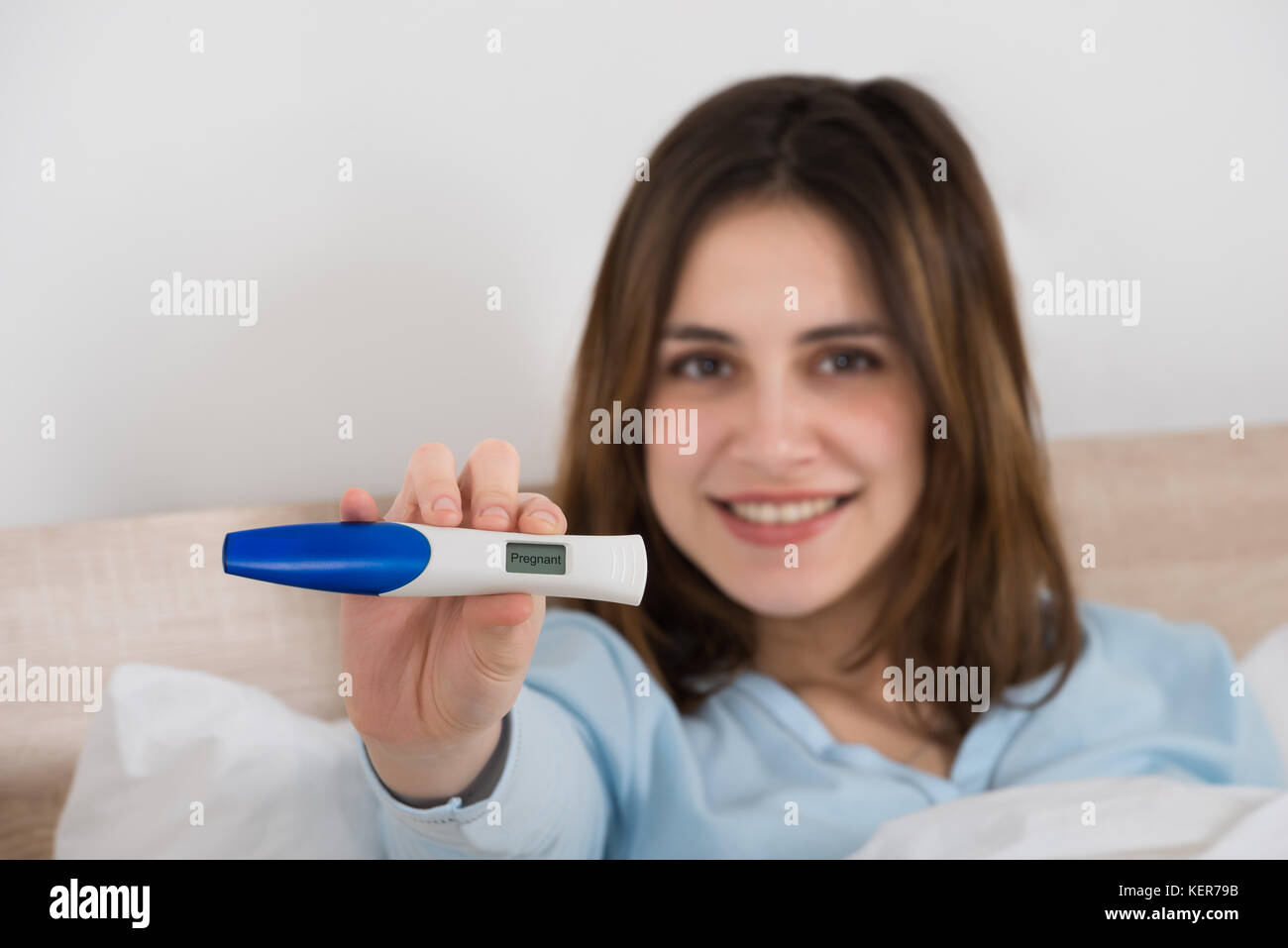 Photo Of Happy Young Woman Holding Pregnancy Test Stock Photo Alamy