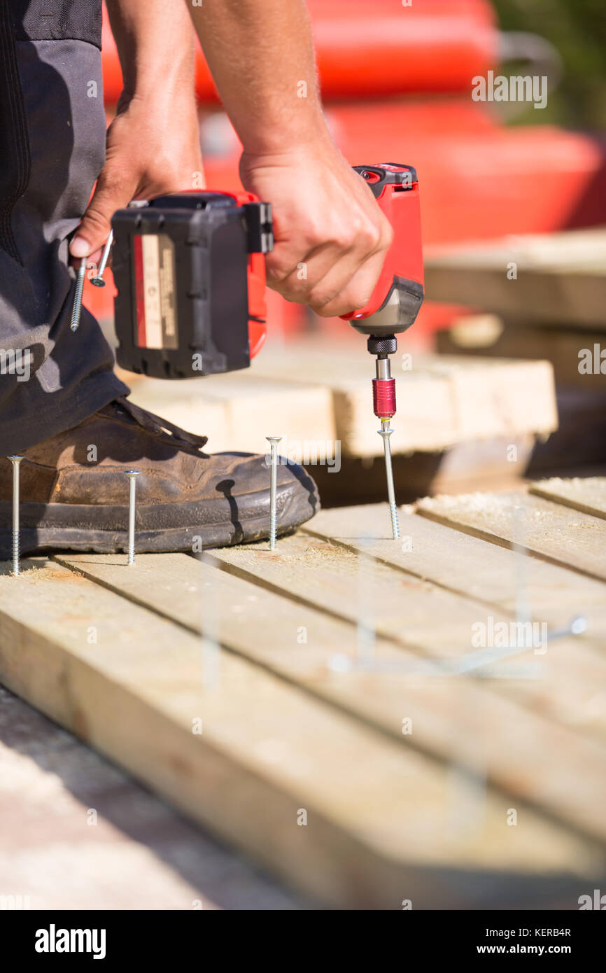 Carpenter working with an electric screwdriver Stock Photo Alamy