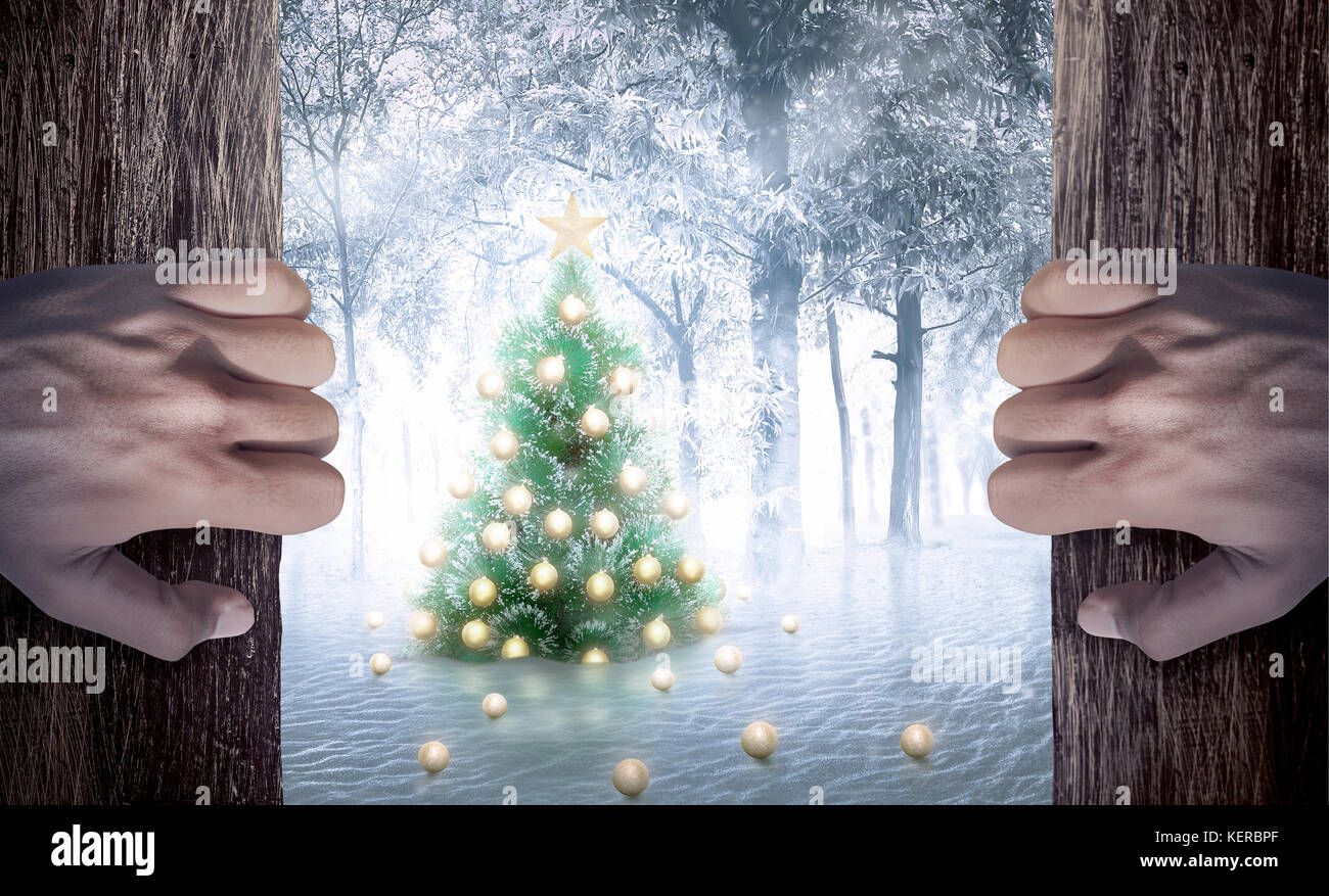 Man hand open the door looking christmas tree on snowy forests Stock