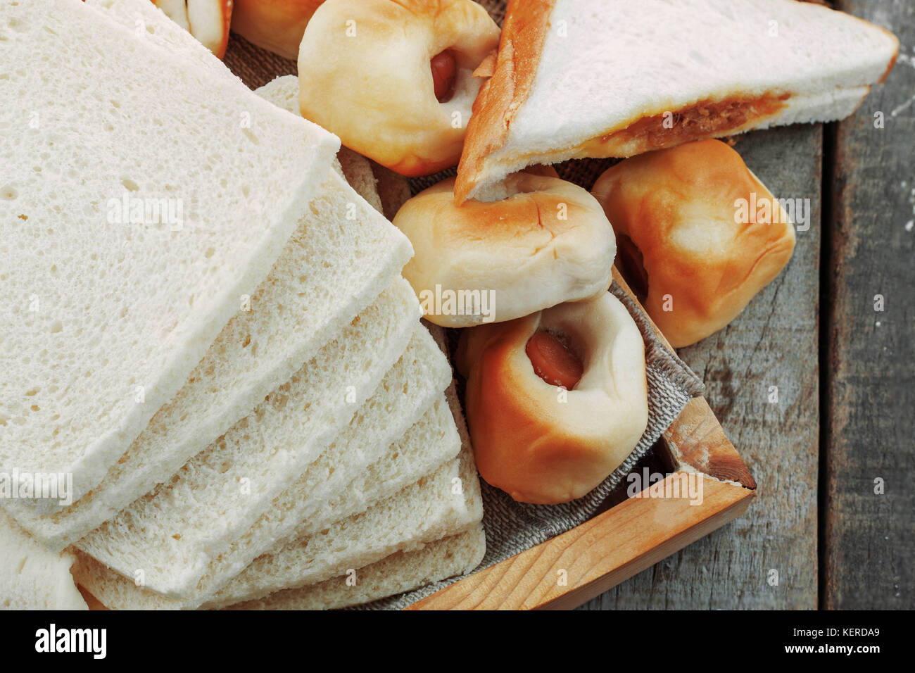 Many breads on wooden tray of table Stock Photo - Alamy