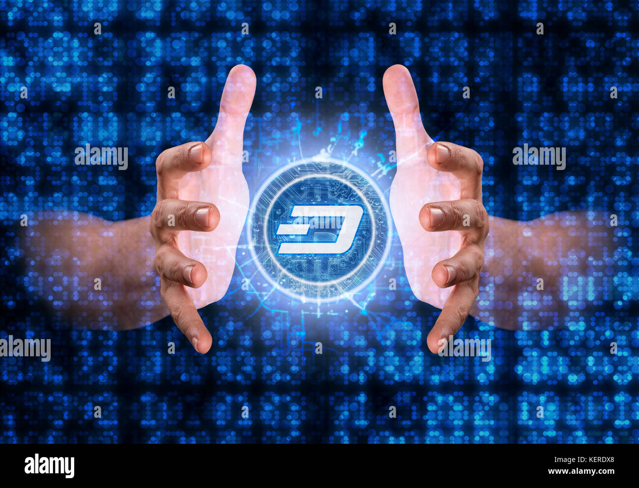 A cryptocurrency dash hologram in coin form hovvering over a computer  circuit board Stock Photo - Alamy