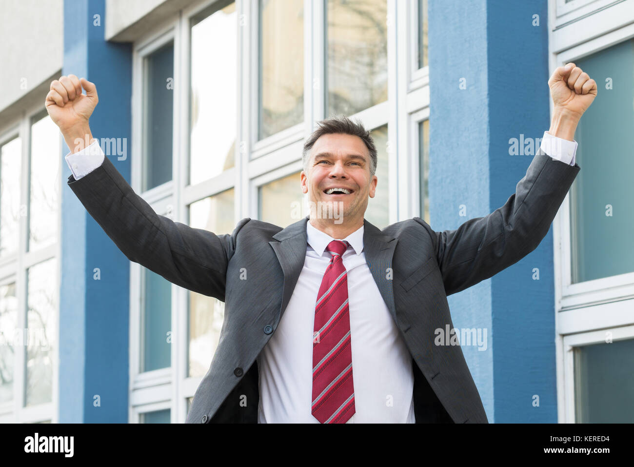Successful Mature Excited Businessman Raising His Fists In The Air ...