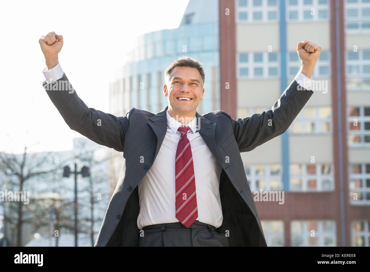 Businessman raising arms in air hi-res stock photography and images - Alamy