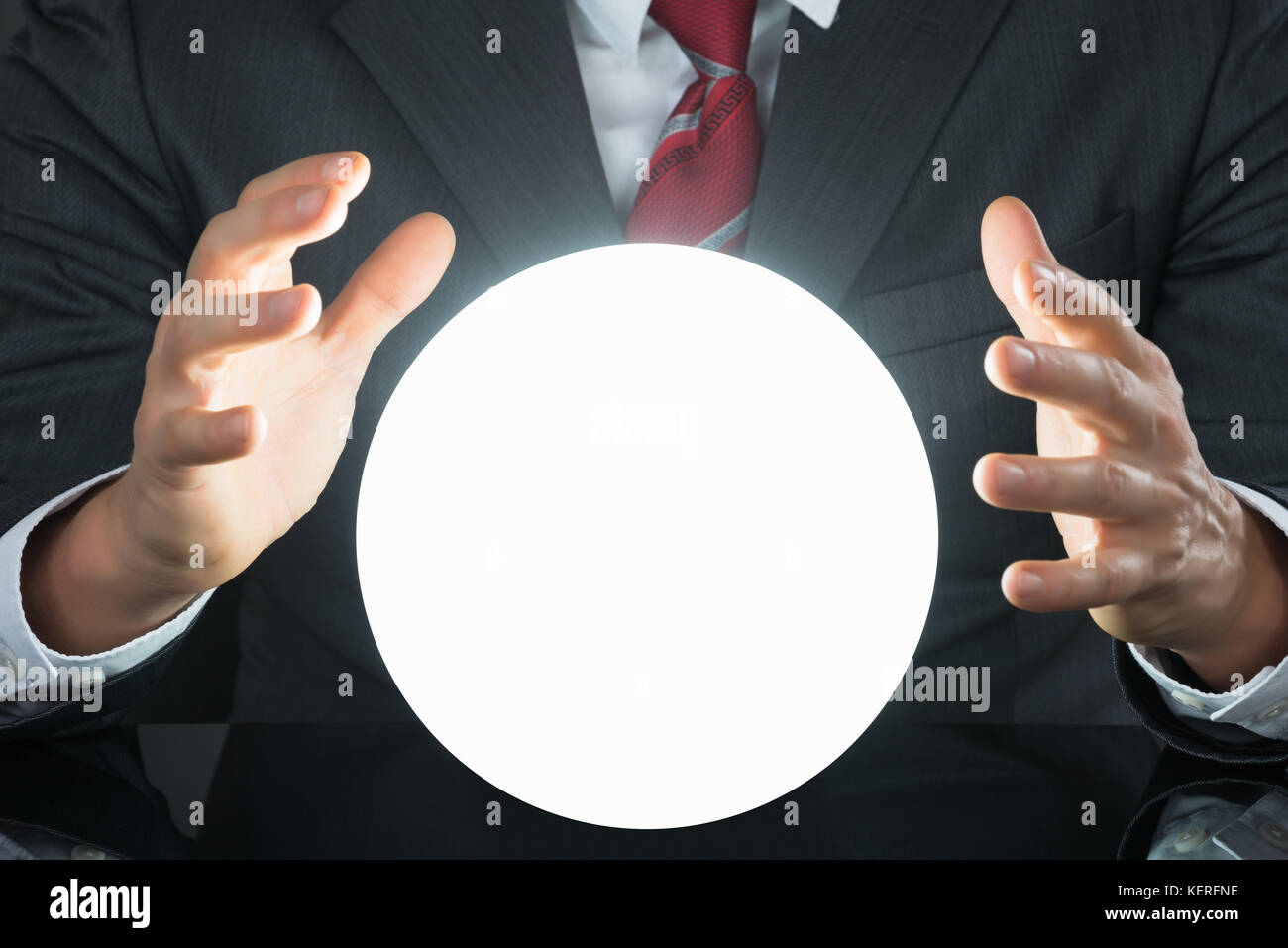 Close-up Of Businessman Hand On Crystal Ball On Desk Stock Photo - Alamy