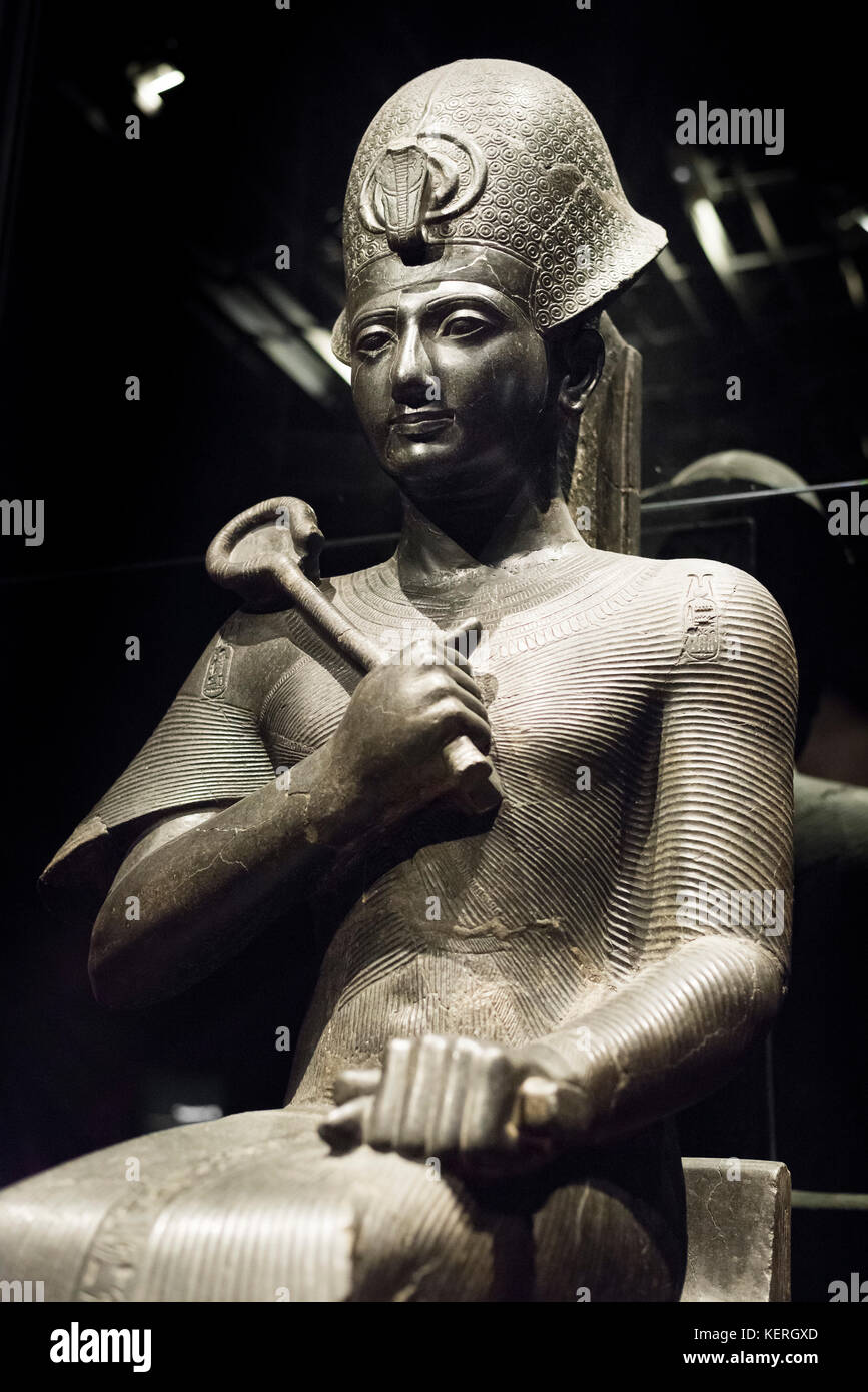 Turin. Italy. Portrait statue of Egyptian Pharaoh Ramesses II wearing a Khepresh crown & holding the Heqa sceptre. New Kingdom, 19th Dynasty (1279-121 Stock Photo