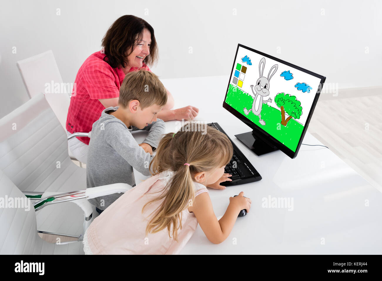 Happy Kids Using Painting Application On Desktop Computer Together With