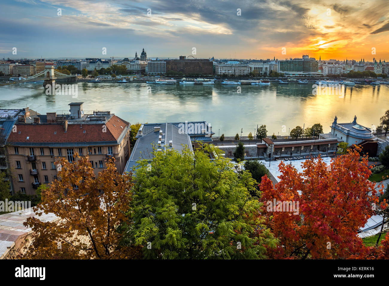 Budapest, Hungary - Autumn colors at the heart of Budapest at sunrise with Szechenyi Chain Bridge and other landmarks Stock Photo