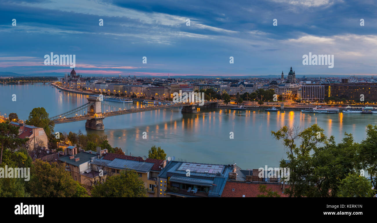 Budapest, Hungary - Panoramic skyline view of Budapest taken from Buda Castle at dawn. This view includes Szechenyi Chain Bridge, St Stephen's basilic Stock Photo