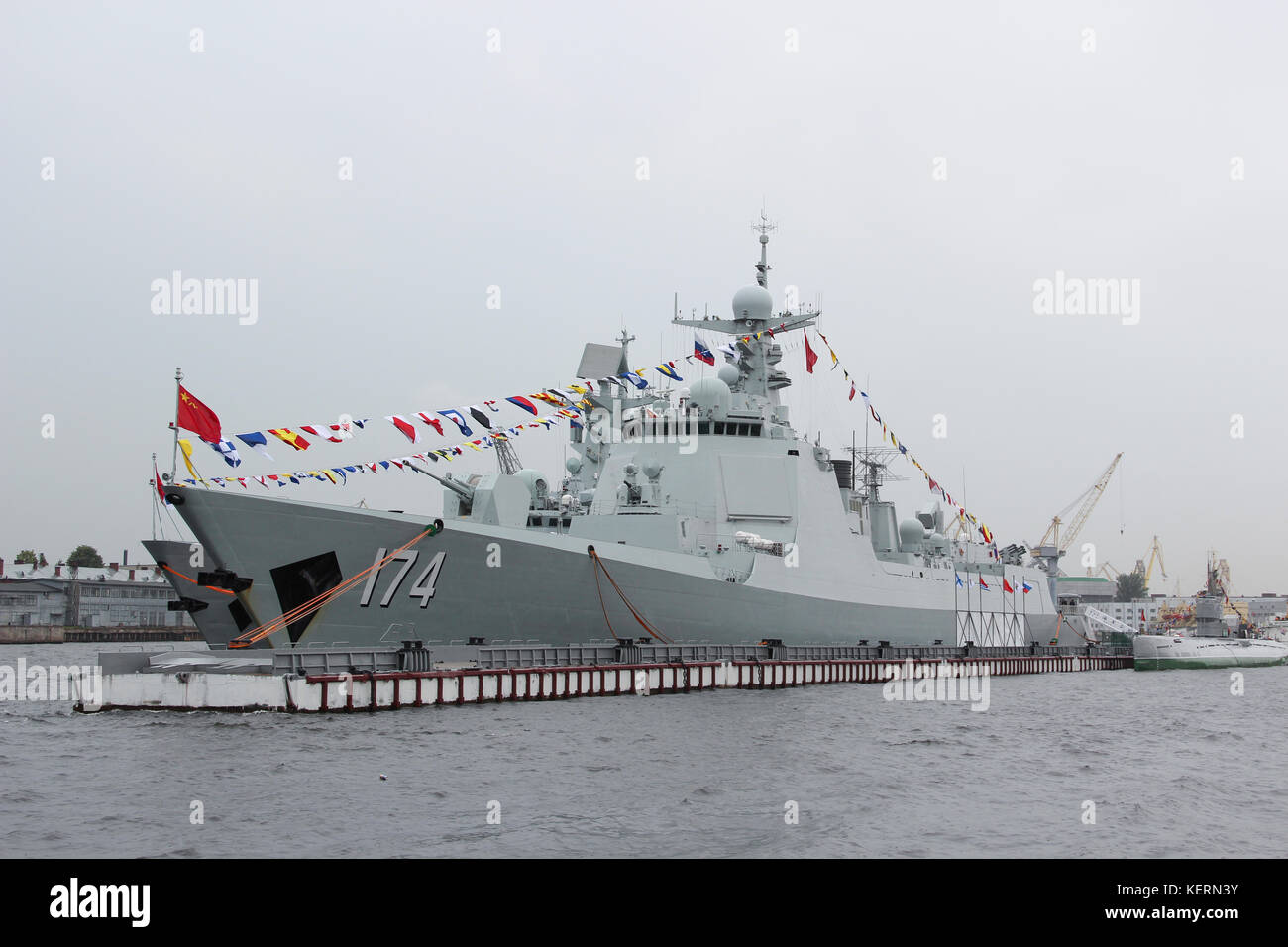 Ships Chinese Navy destroyer 'Haifa' and the frigate 'Unicen' in the harbour in the city centre. Invited to the celebration of Russian Navy day. Rain. Stock Photo
