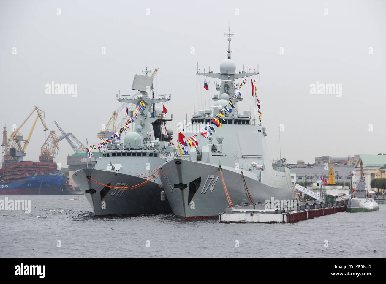 Ships Chinese Navy destroyer 'Haifa' and the frigate 'Unicen' in the harbour in the city centre. Invited to the celebration of Russian Navy day. Rain. Stock Photo