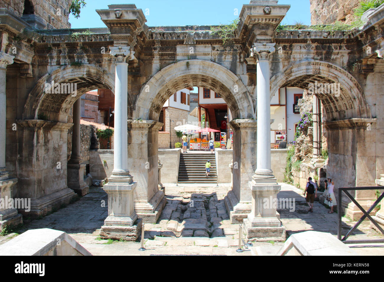 The ancient triumphal arch of the Emperor Hadrian in the city center in front of the entrance to the old town - Kaleici. Stock Photo