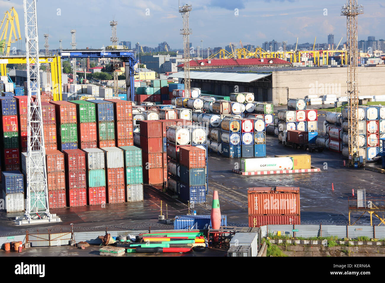 freight shipping containers and gas tanks at the docks. in import