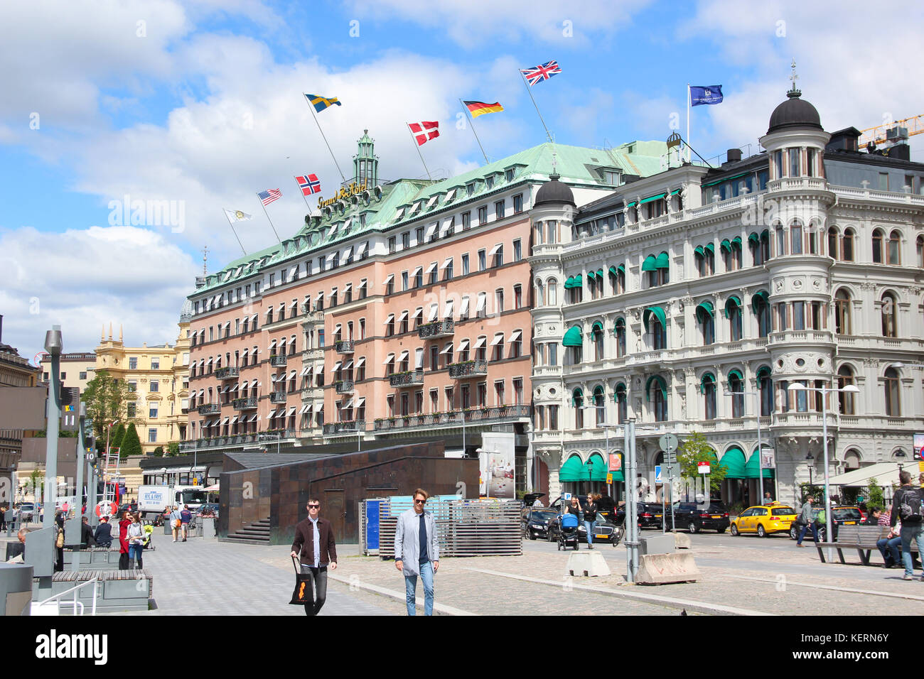 View to the building of the Grand Hotel Stockholm with flags of different countries (USA, Finland, Norway, Sweden, Denmark, Germany, Great Britain) Stock Photo