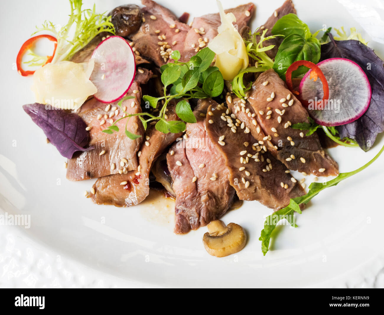 Sleepy lamb terraic in meat sauce and shiitake mushrooms Stock Photo