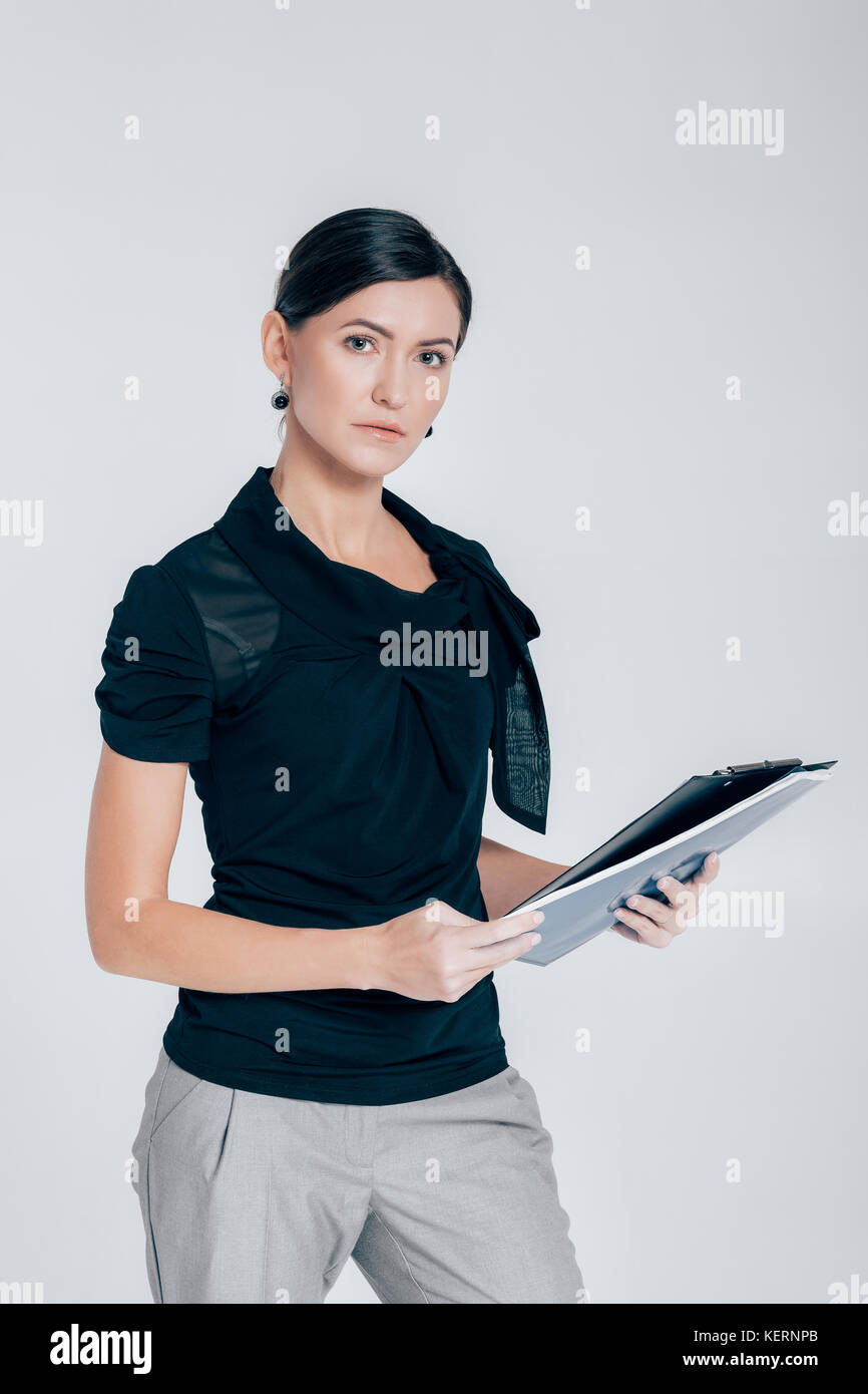 attractive business woman on gray background Stock Photo - Alamy
