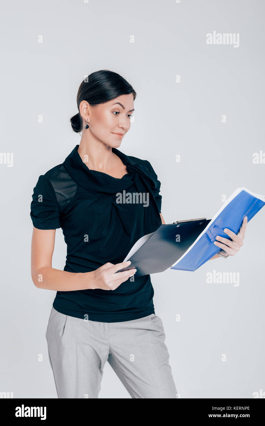 attractive business woman on gray background Stock Photo - Alamy