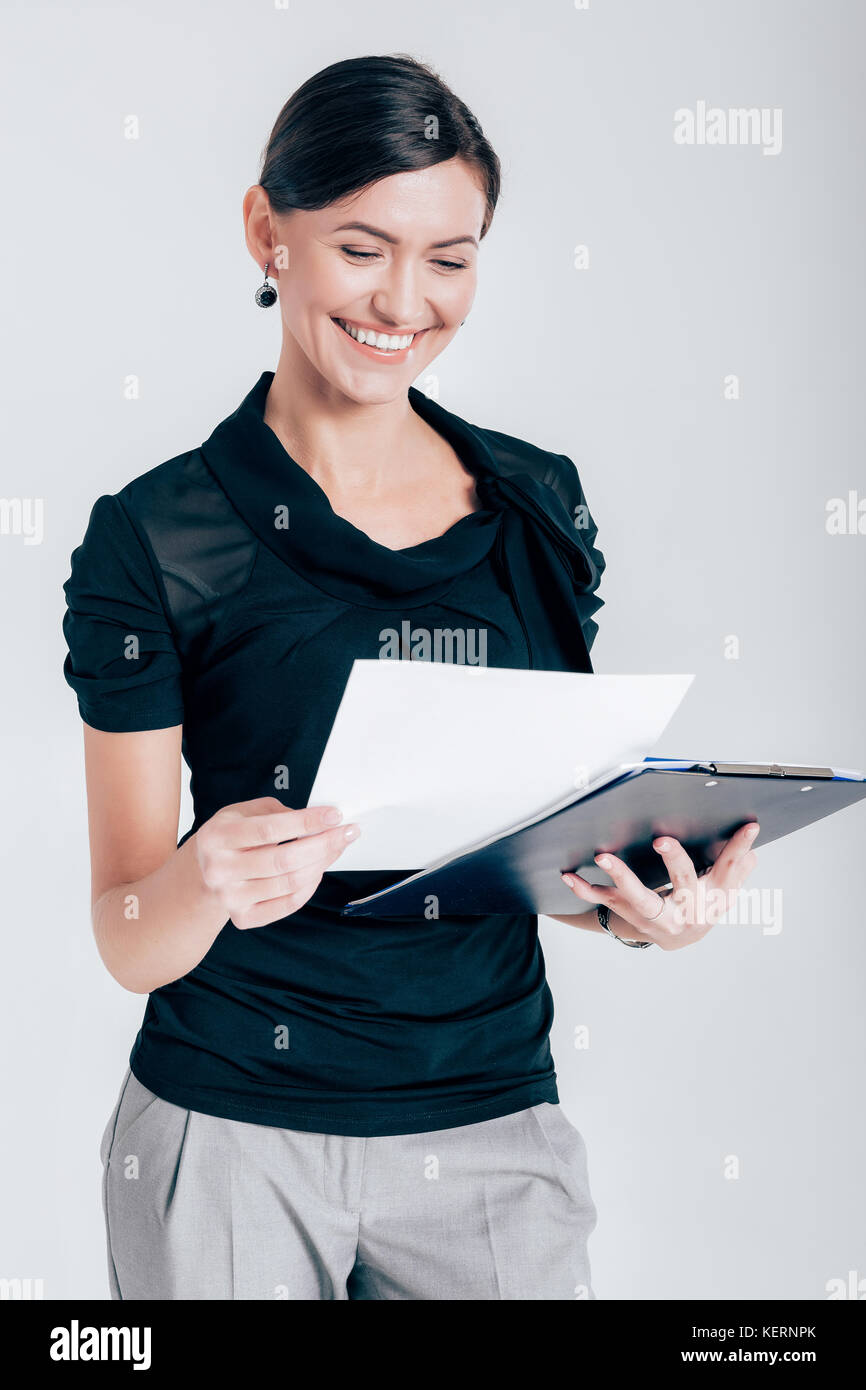 attractive business woman on gray background Stock Photo - Alamy