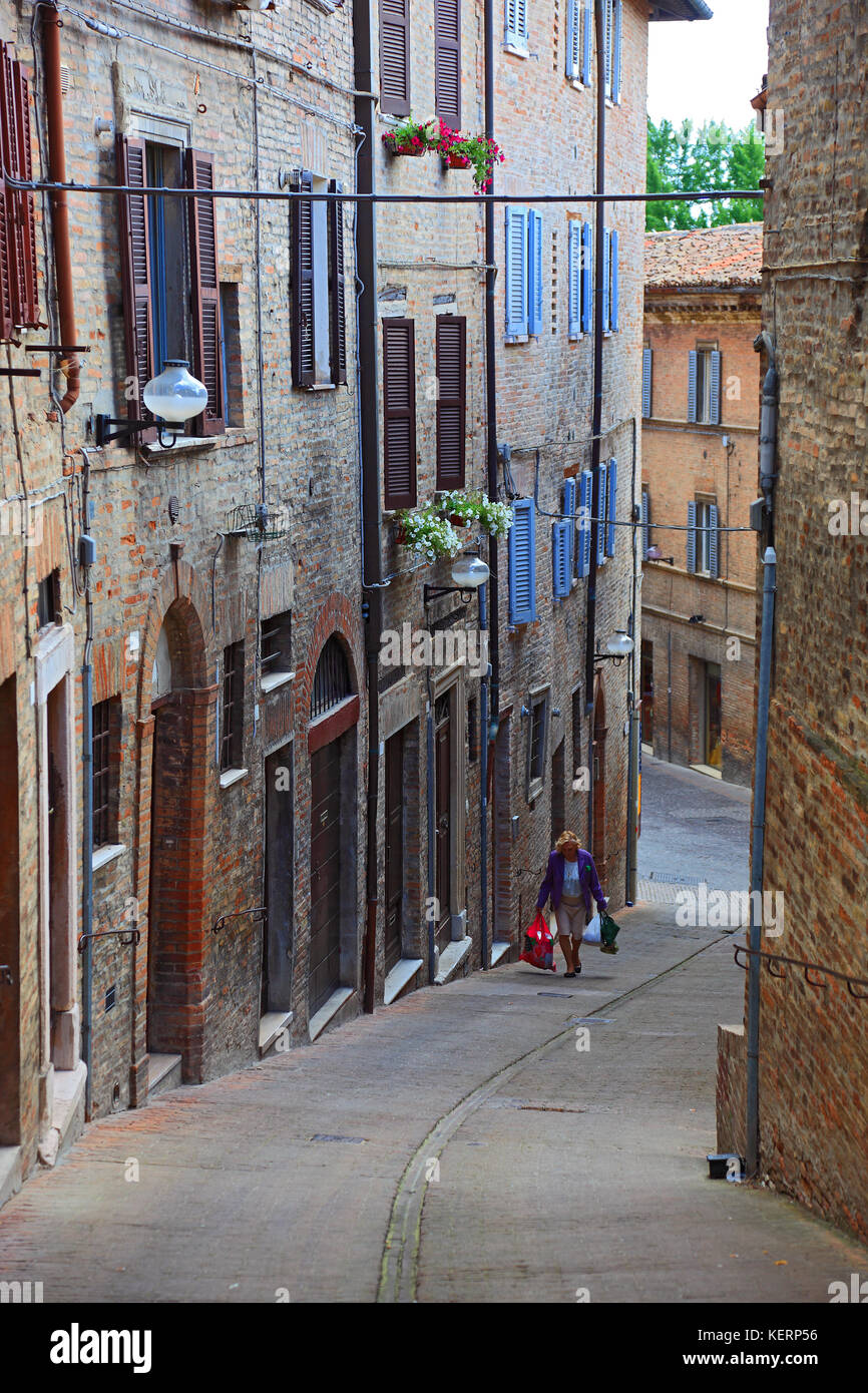 Narrow street in the old city of Urbino, Marche, Italy Stock Photo