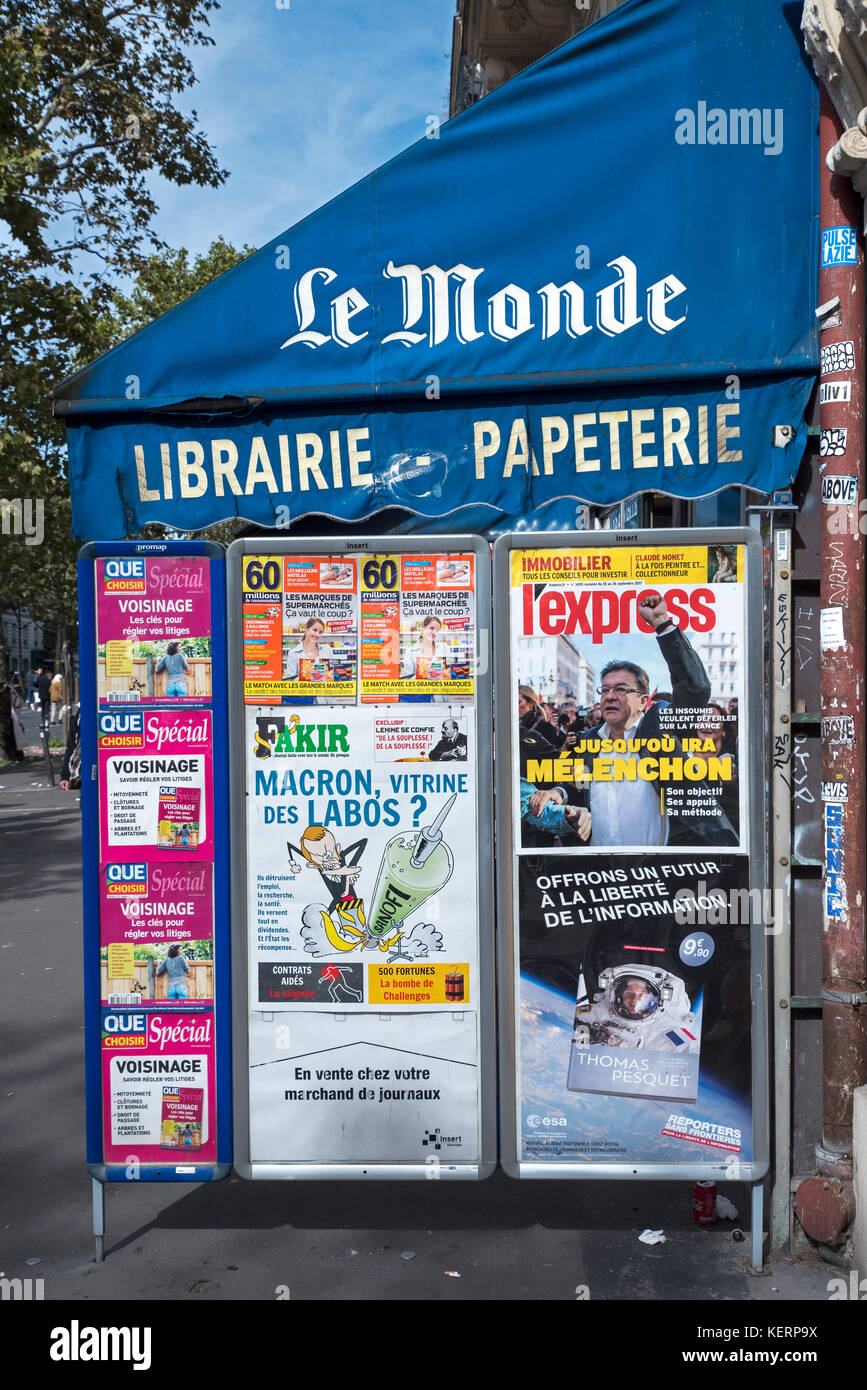 Magazine adverts on the canopy of a french newsagent's shop in Paris, France. Stock Photo