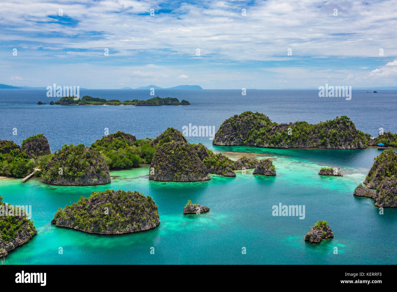 Pianemo Islands, Blue Lagoon with Green Rocks, Raja Ampat, West Papua, Indonesia. Stock Photo