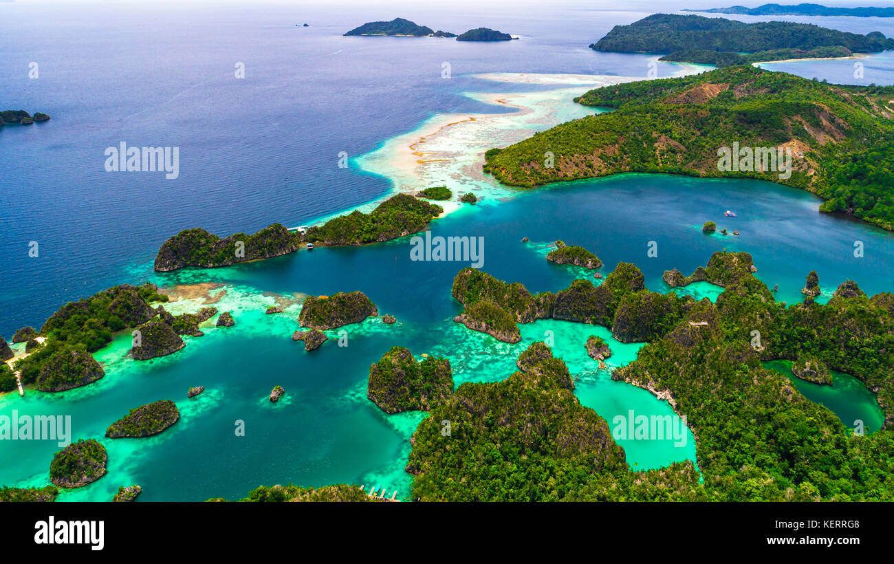 Pianemo Islands, Blue Lagoon with Green Rocks, Raja Ampat, West Papua, Indonesia. Stock Photo
