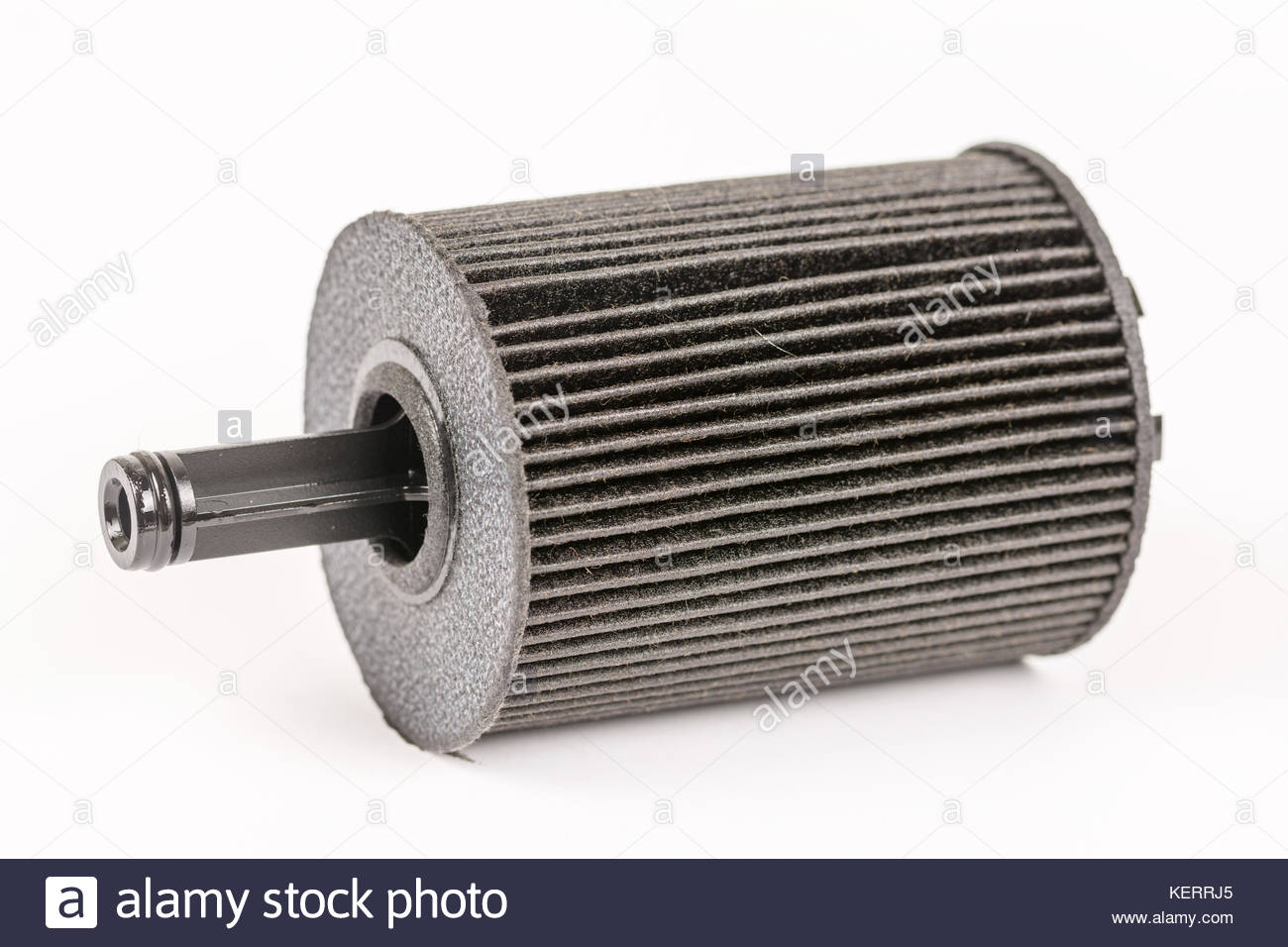 Old used and dirty car fuel filter isolated above white background. - Stock Image