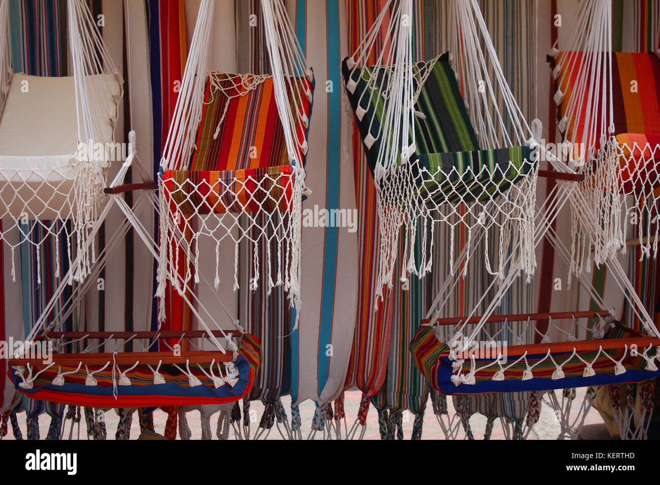 Colorful hammocks for sale at the outdoor craft market in Otavalo, Ecuador Stock Photo