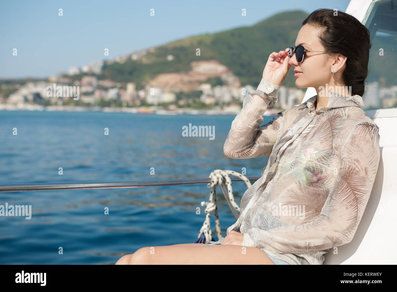 woman aboard a boat looking at the sea Stock Photo - Alamy