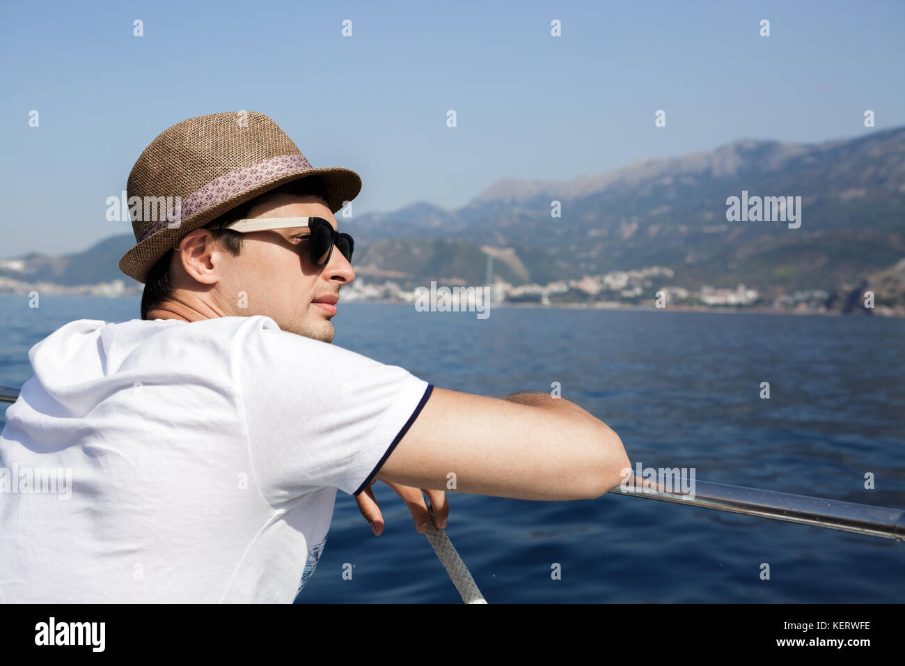 man aboard a boat looking at the sea Stock Photo - Alamy