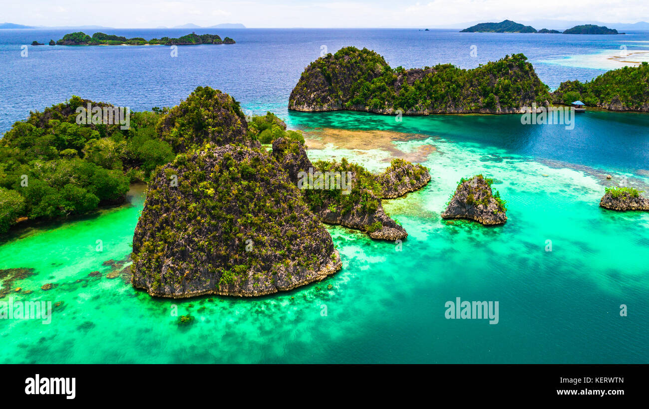 Pianemo Islands, Blue Lagoon with Green Rocks, Raja Ampat, West Papua, Indonesia. Stock Photo