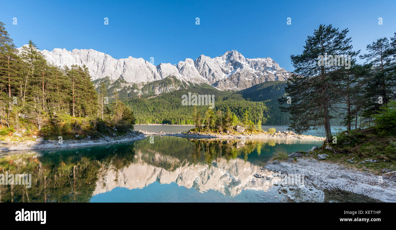 Lake Eibsee lake with Sasseninsel and Zugspitze, reflection in the lake ...