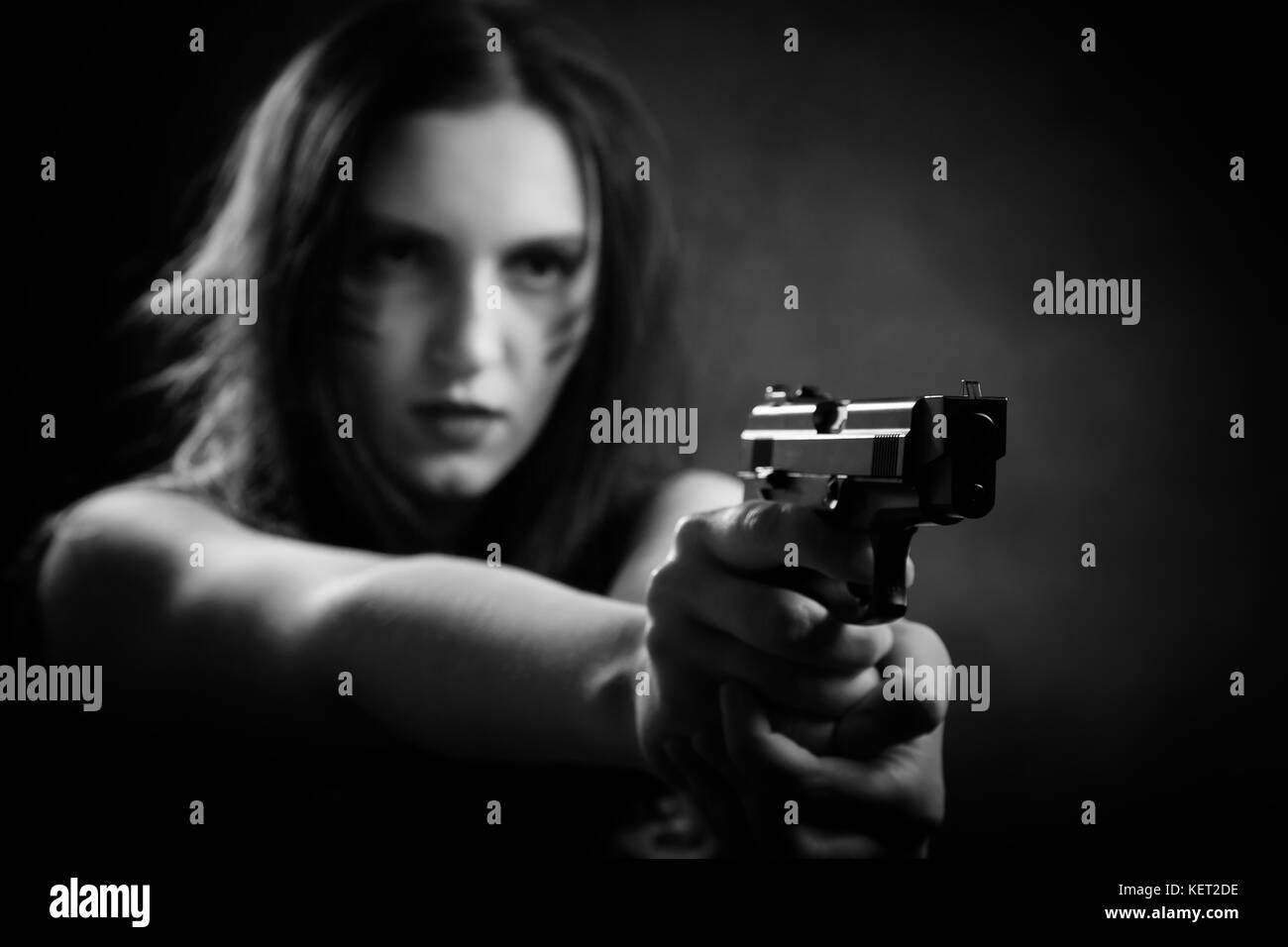 Serious woman aiming gun hi-res stock photography and images - Alamy